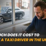 Man reviewing paperwork at a desk beside a parked taxi