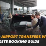 A couple loading suitcases into a black car outside an airport terminal.